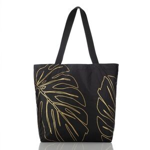 Aloha Collection Lānai Black and Gold Monstera Tote Bag